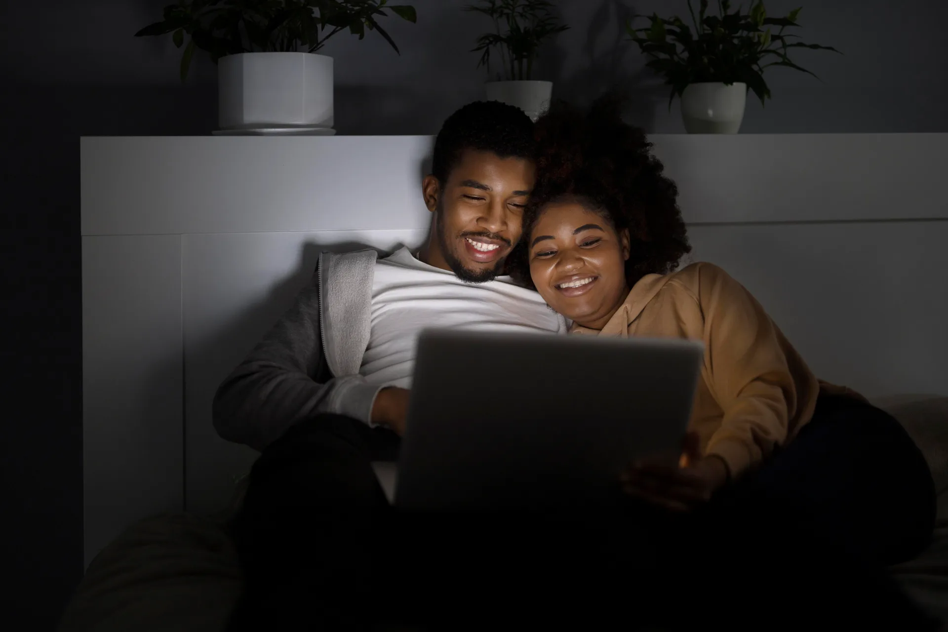 A couple relaxing at home, streaming on fast internet